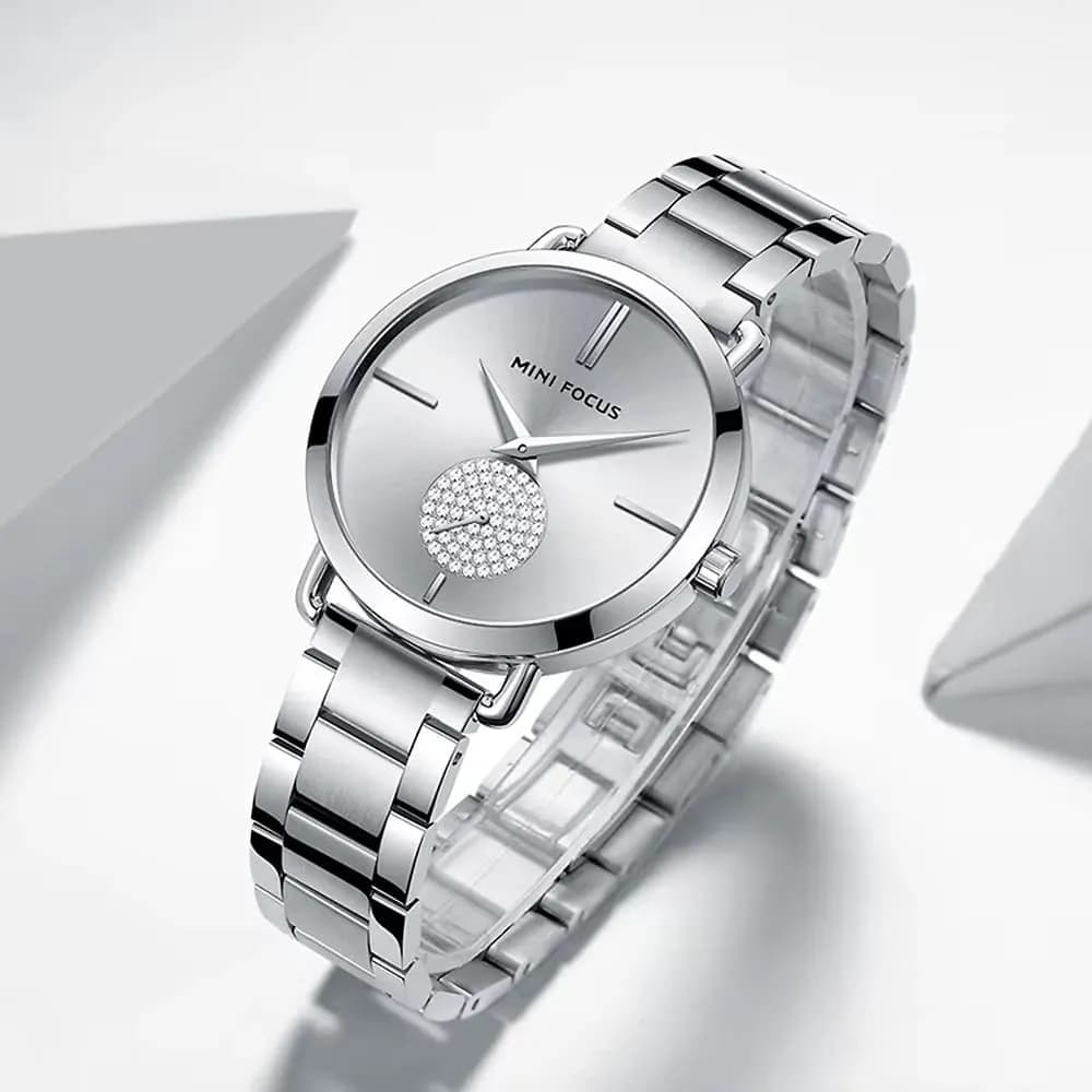 Side view highlighting the slim case and crystal crown